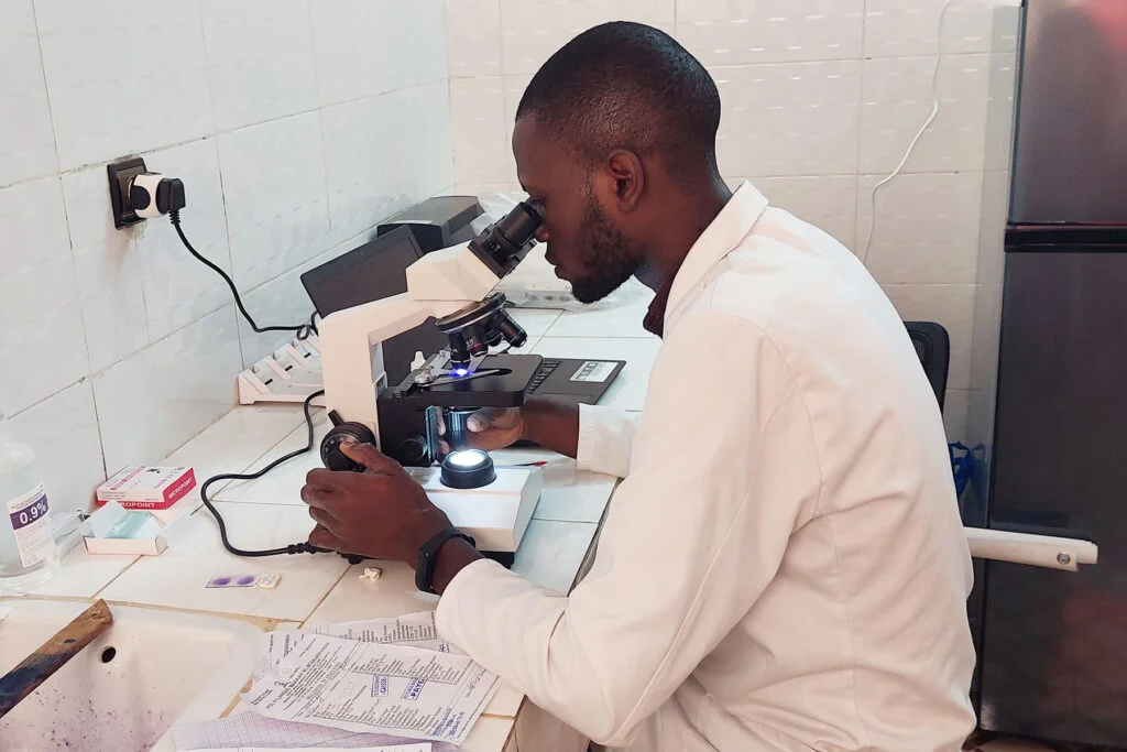 Medical professional working with laboratory equipment