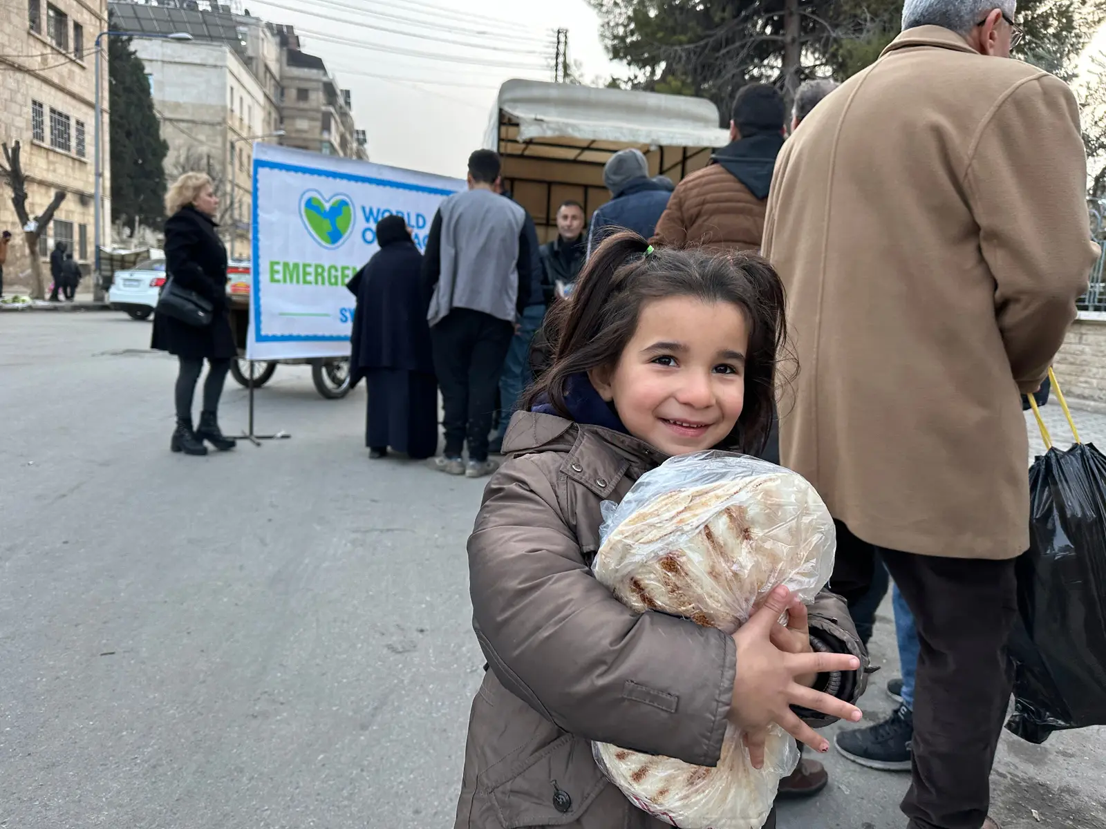 Girl with bread in Syria
